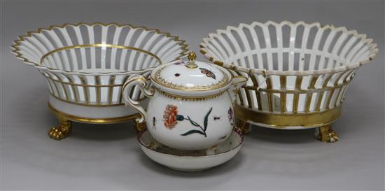 A 19th century Meissen jug and cover, cracked, 12.5cm., a Berlin gilt porcelain basket, another similar basket